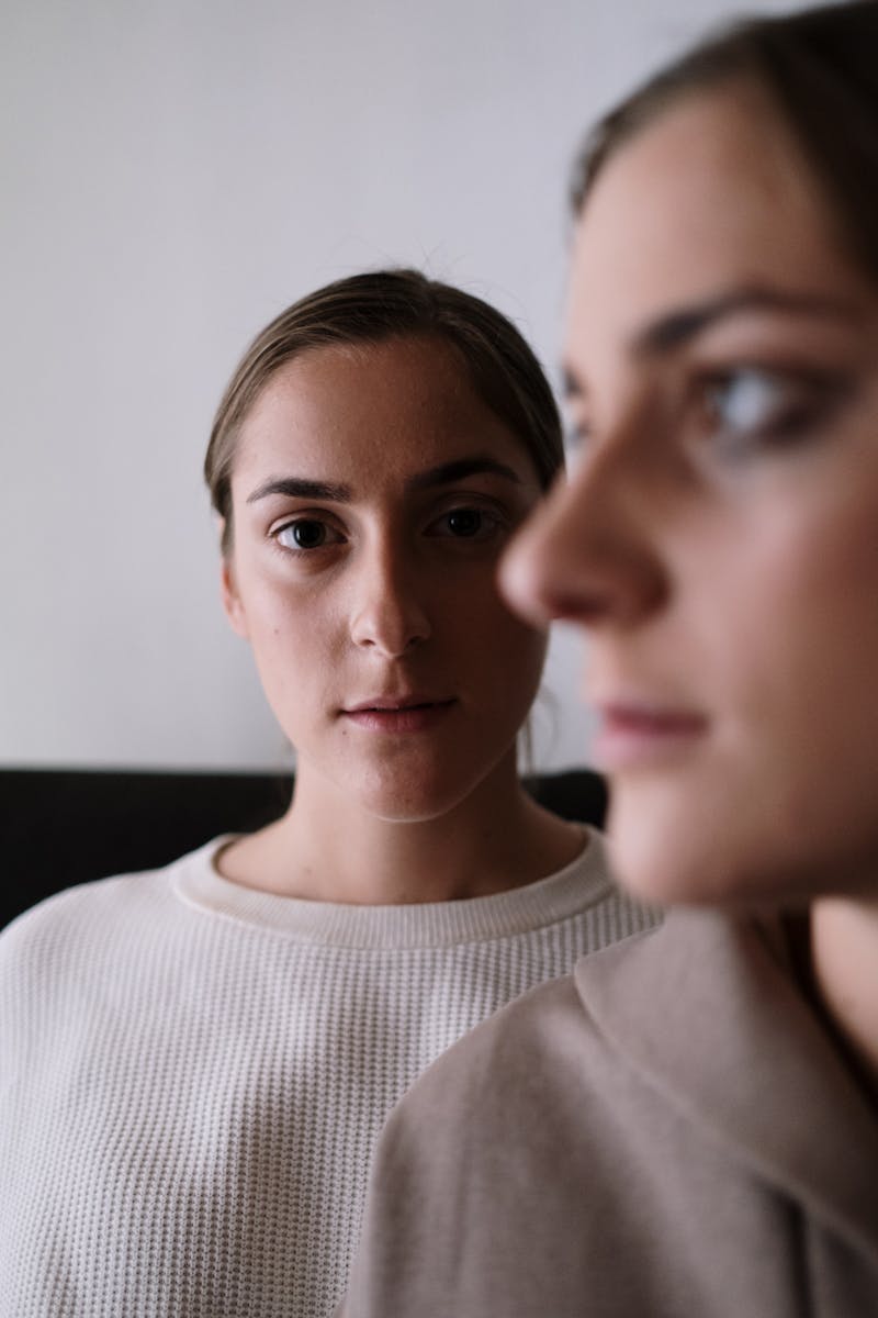 A conceptual portrait capturing the theme of mental health awareness with two women in focus.
